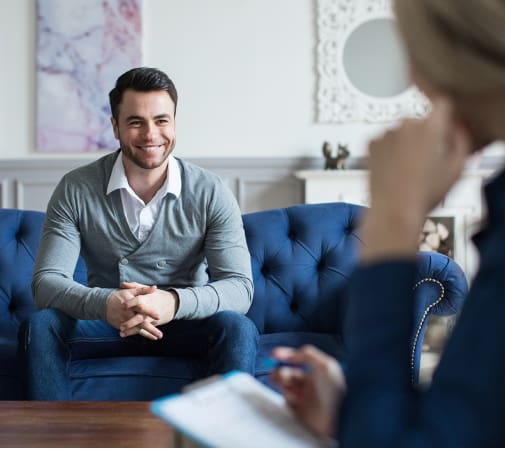 man smiling at therapy session